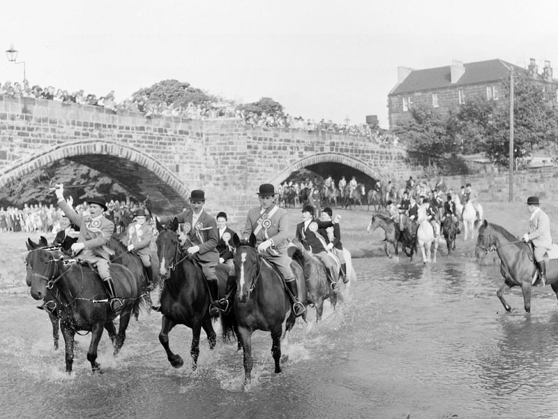 Musselburgh Crusaders riding club ride over the River Esk on the traditional Crusader's Chase in July 1965.
