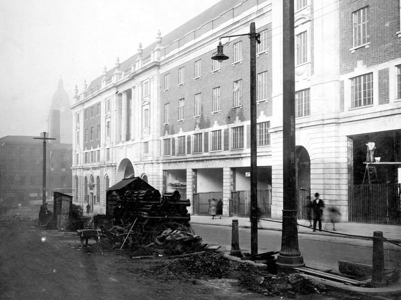 Looking at new block of building. Permanent House at junction with Cookridge Street, Leeds Town Hall in background.