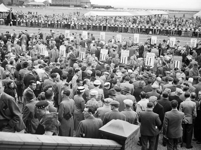 A view of the crowds at Musselburgh Races in July 1957.