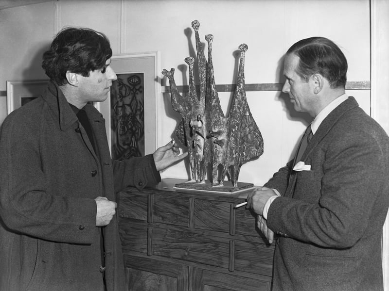 Born in Leeds, Armitage became a major figure in post-war British sculpture. He represented Britain at the Venice Biennale and is known for his semi-abstract bronze figures that often appear joined together in groups.