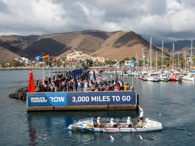 Royal Navy sailors aboard HMS Oardacious finished "the world's toughest row", a trek of 3,000 miles from the Canaries to Antigua.