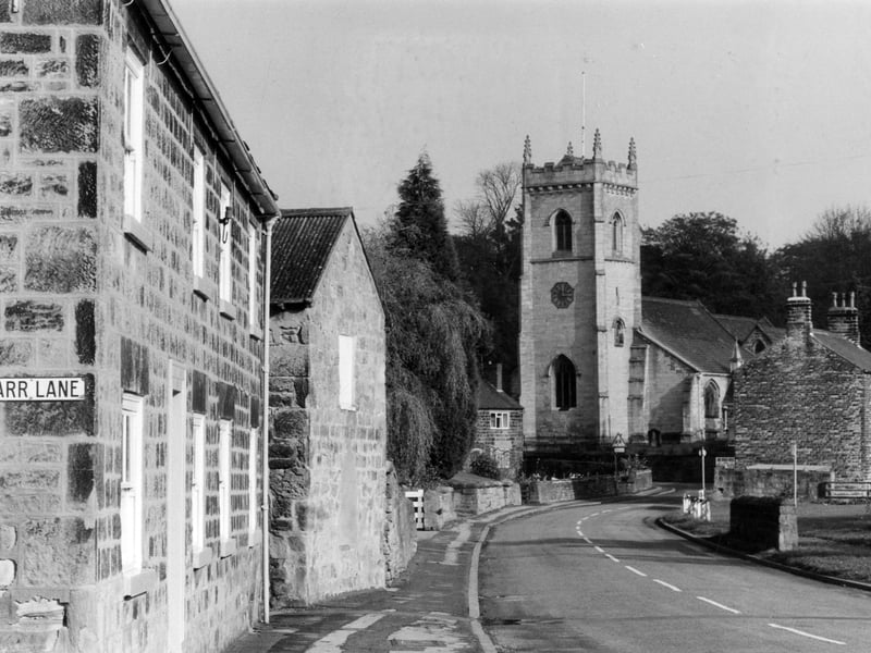 Looking north-east along Main Street towards St. Peter's Church on Church View. The junction with Carr Lane is on the left by the side of Dove Cotttage at no. 6 Main Street. The house on the far right is Moat House.
