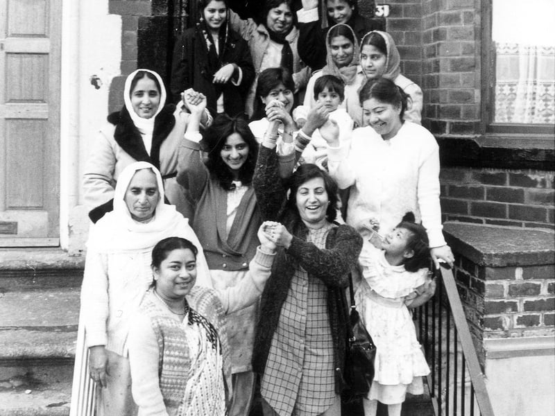A group of women and children celebrating the opening of the Milun Womens' Centre on Hilton Road in December 1988. 'Milun' means 'togetherness' in three languages, Punjabi, Urdu and Bengali.