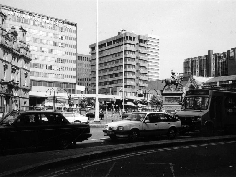City Square from Wellington Street showing, from left, the General Post Office building, the Norwich Union Insurance Group offices then, after the junction with Park Row, the National Westminster Bank. On the right is Mill Hill Chapel with the top of the Bond Street Centre behind. The mounted statue of the Black Prince is also visible. In the background Lloyds Bank and West Riding House are seen on either side of the Nat West building.