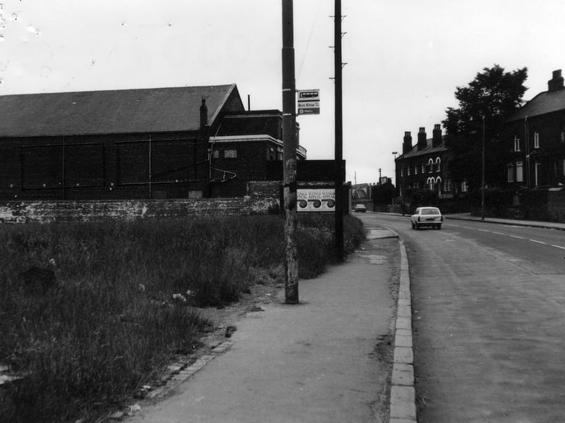 Looking west along Tong Road in August 1981. The Lyric cinema is seen on the left, while on the right are the rears of houses on Southfield Mount and Cricketers Terrace.