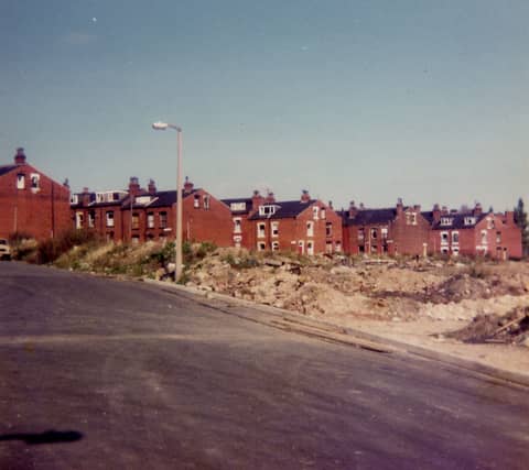 A view from Armley Grove Place in October 1983 showing in the foreground a cleared area where terraced housing has recently been demolished with other streets set to follow.