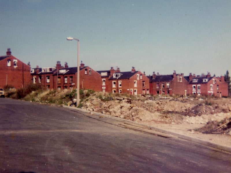 A view from Armley Grove Place in October 1983 showing in the foreground a cleared area where terraced housing has recently been demolished with other streets set to follow.