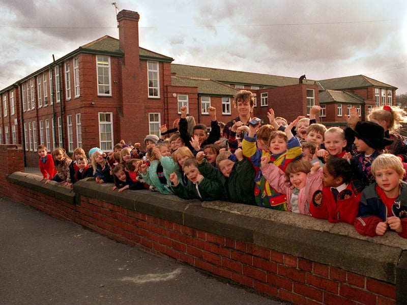 Pupils at Bentley Primary celebrate after been told that Leeds City council would look into providing money for a security fence around the school. They are pictured with head teacher Margaret Cawsey.