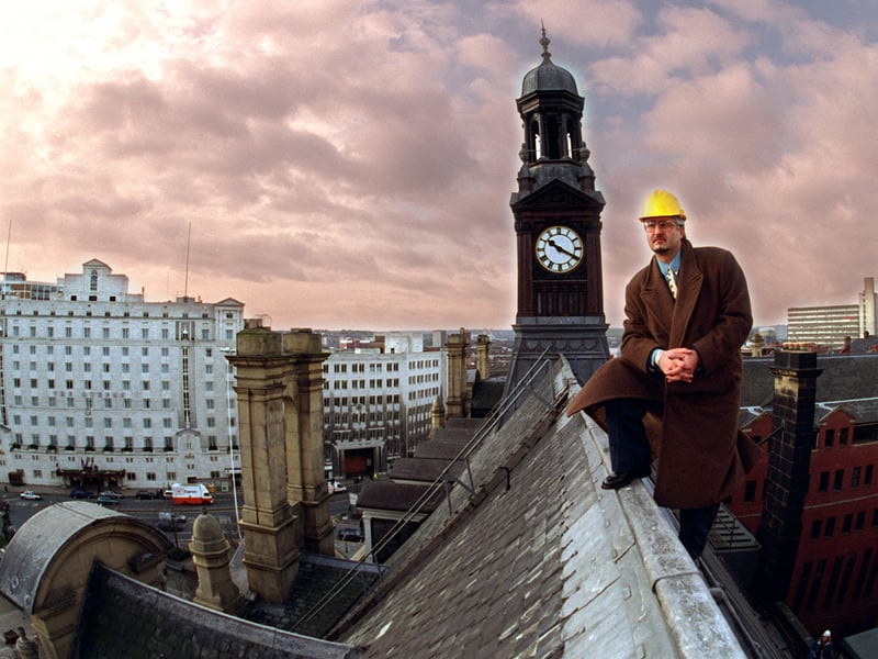 Area building surveyor Peter Burns looks over City Square with a restored solid oak clock tower on the main post office in the back ground.