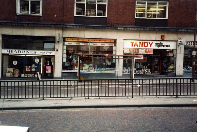 Shops on Eastgate in March 1984. Pictured, from left, is Headlines Hair Design, Tandys Hi-Fi and audio superstore, and just visible on the right, Peter Maturi Cutlery specialists.