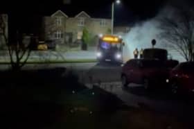 This is the moment a bus got stranded on a grass verge in Abbey Lane in Sheffield, causing smoke to plume from its exhaust when it tried to accelerate.