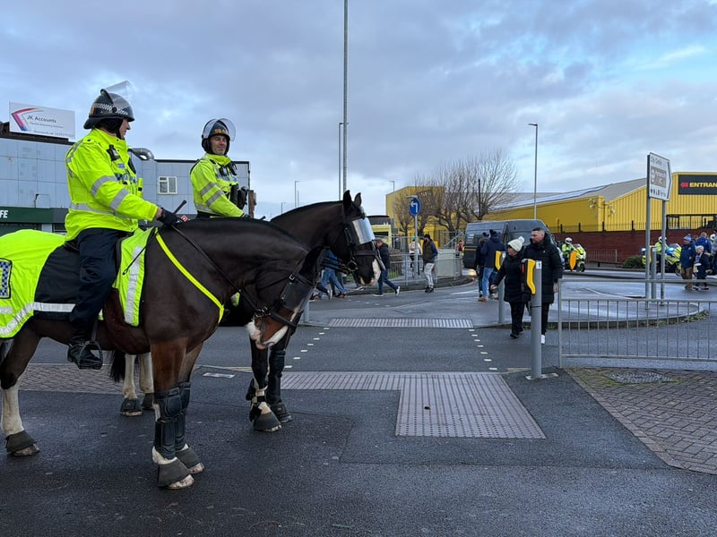 Heavy police presence around Fratton Park, including police horses