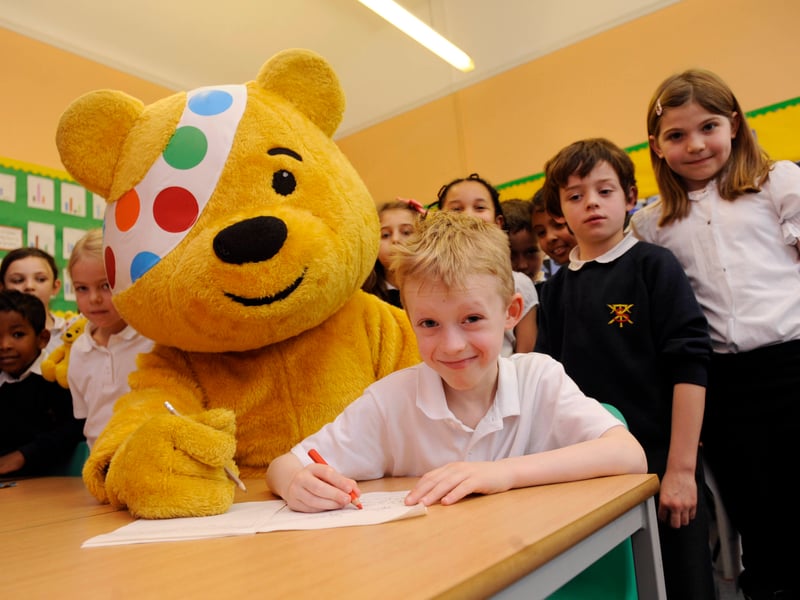 Pupils of Tollcross Primary School got to meet Pudsey Bear of charity Children In Need in November, 2012 - pictured getting help with his school work is 7-year-old Toby Duncan.