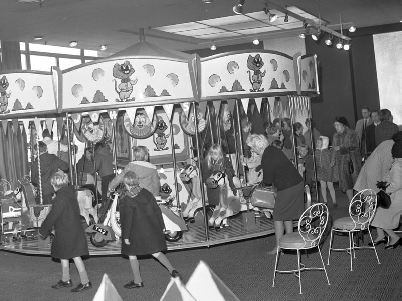 The funfair roundabout inside Goldbergs department store in Edinburgh, November 1968.