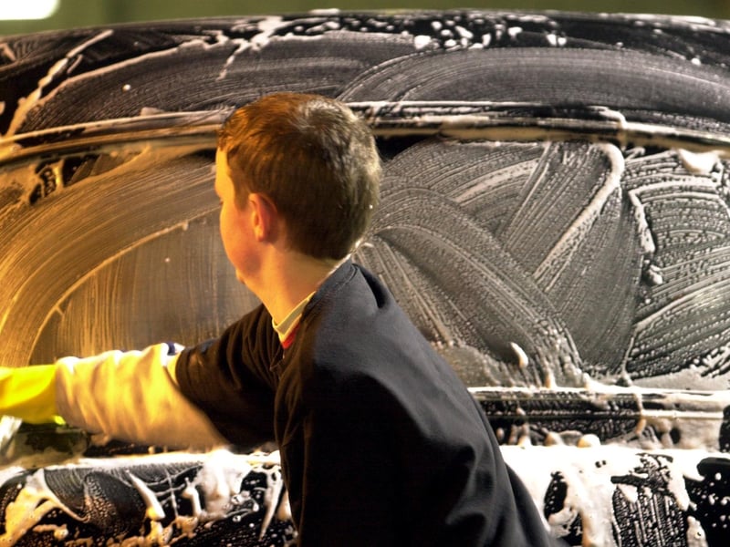 Pupils from George Watson's College held a charity car wash at Lochrin Autos, Tollcross, in February, 2002, to raise money for Barnardos. The picture shows third year pupil Richard Marshall, 14, giving a taxi a wash. 