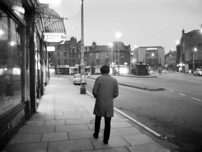Home Street in the Tollcross area of Edinburgh at night, in May, 1970, looking towards Lauriston Place on the right with Goldberg's store clearly visible.