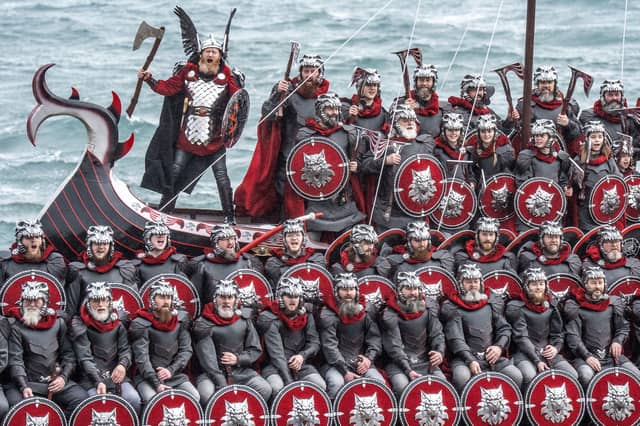 Members of the Jarl Squad on the galley at the harbour.