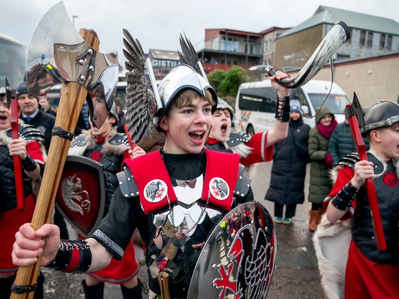 Members of the Junior Jarl Squad parade through Lerwick on the Shetland Isles during the Up Helly Aa festival.