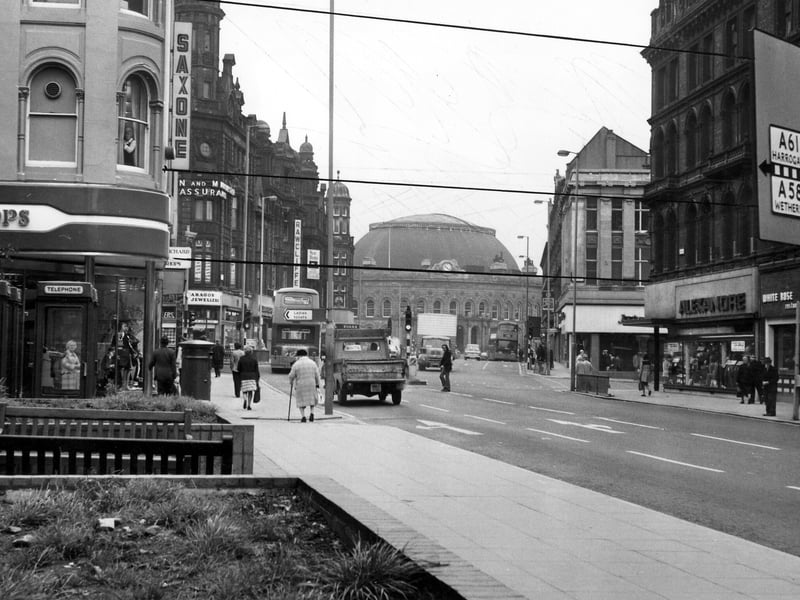 Boar Lane looking east towards the Corn Exchange, taken during the mid 1970s. On the left is Richard Shops ladieswear, then Saxone shoes, the junction with Briggate, Paragon Jewellers and Rawcliffe's tailors. On the right are the White Rose Restaurant, Alexandre Menswear, the junction with Briggate and Jackson's tailors.