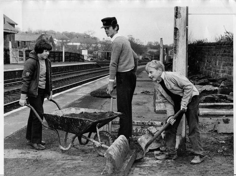 Boys from the Wharfedale Railway Society re-lay flower beds on the platform at Horsforth, near Leeds, in December 1971