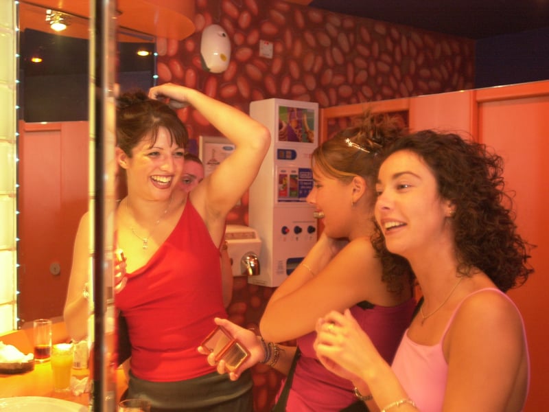 Leanna Stoner, Avril Walls and Gwen Lister in the toilets of Eros nightclub, Fountainbridge, in 2000, discussing the chat-up lines they have heard, while fixing their make-up