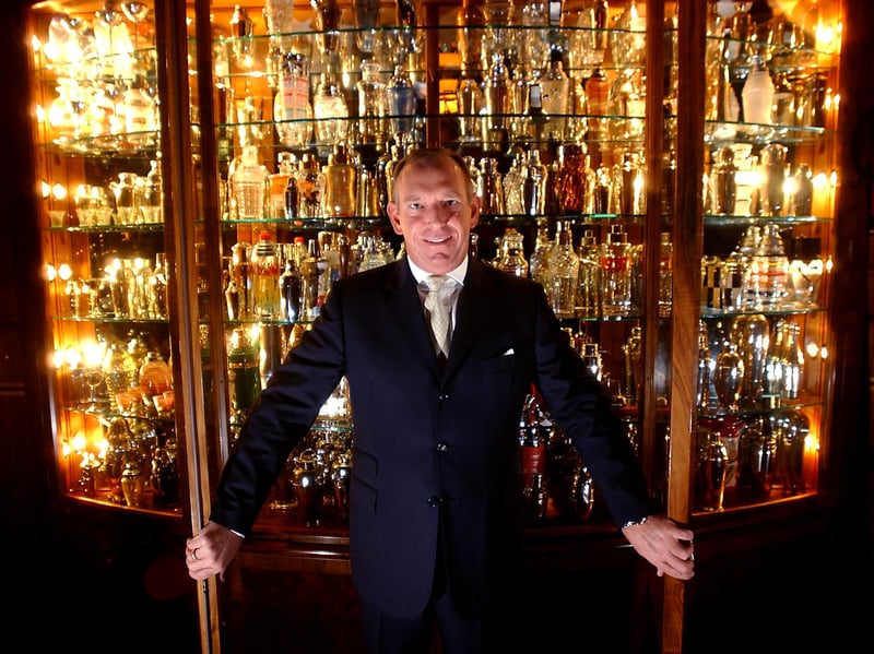 Brian Crawford, who runs the Dome nightclub on George Street, Edinburgh. pictured in front of his cabinet full of cocktail shakers inside the club in 2002