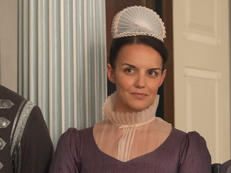 Having appeared as an extra already in Bridgerton and Queen Charlotte, in season four of the show Sophie Lamont steps slightly further into the spotlight as Celia, who is described as Mrs. Wilson’s right hand woman. Her character is said to be good natured, if slightly distracted. 
