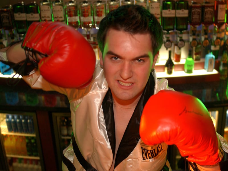 Tommy Conway behind the bar at the new bar/restaurant/nightclub Sportsters, on Market Street, Edinburgh, in July 2003