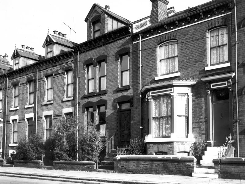 A row of through terraced houses on Westfield Road each with a small private front garden. Pictured in November 1967.