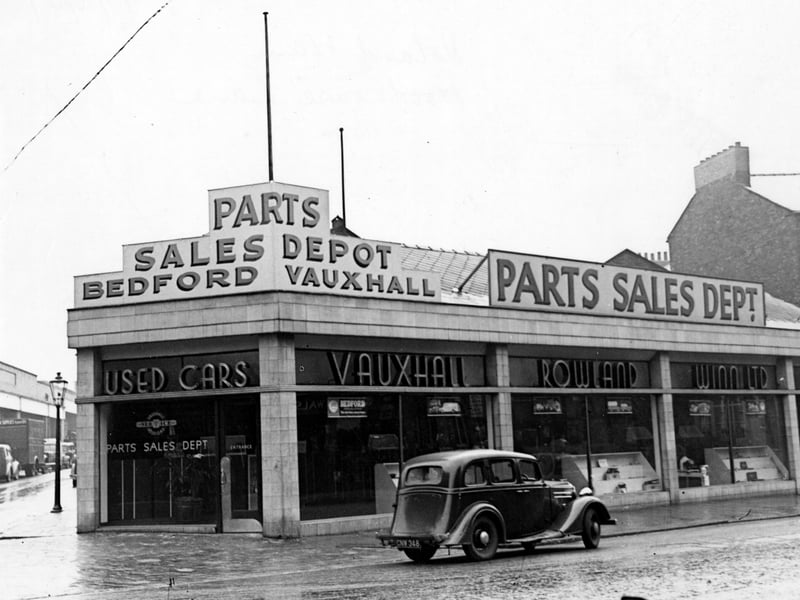 Garage premises of Rowland Winn Ltd. at number 62A Woodhouse Lane at the junction with St. Columba Street, seen far left. The company had the main dealership for Vauxhall-Bedford in Leeds. They also had premises on the opposite side of Woodhouse Lane next to the junction with Vernon Street. Pictured in October 1947.