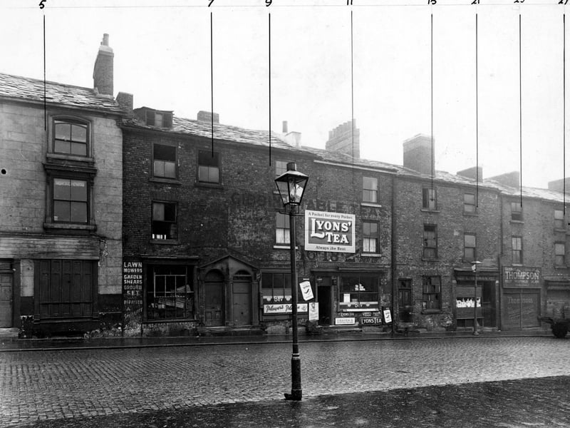 Looking north on George Street in October 1947, showing the following properties; number 5, not known; number 7 is derelict; numbers 9 to 11, Holdswoth's coffee and cocoa house; number 15 is derelict; number 21, L. Newman, paper bag manufacturer; number 25, G. Thompson, fruitier.