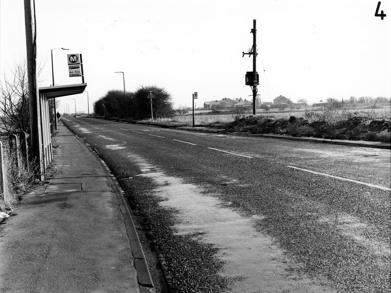 A view looking east along Barnsdale Road in January 1991, showing bus stops on either side of the road.