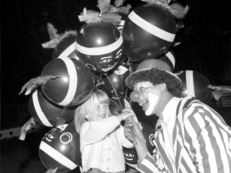 Little Sandra Mathie gets a balloon from one of the clowns at Billy Smart's Circus at Murrayfield in June 1966.