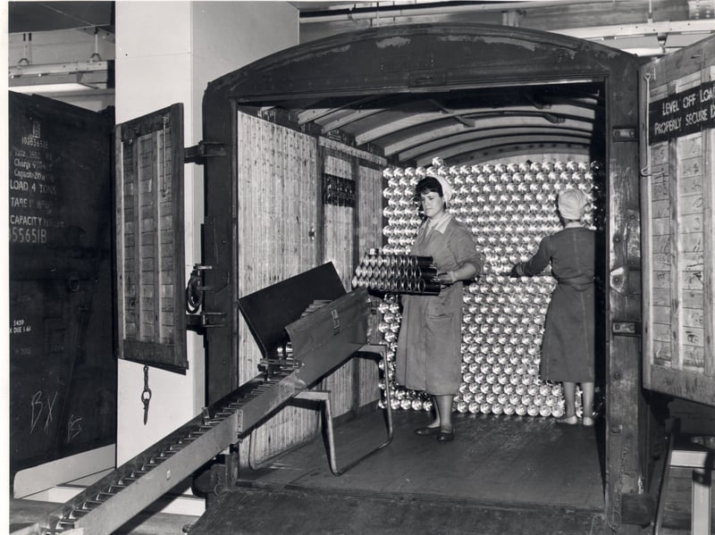 A container, from the Metal Box Company is unloaded inside the Batchelor Foods factory at Wadsley Bridge, Sheffield, in 1961