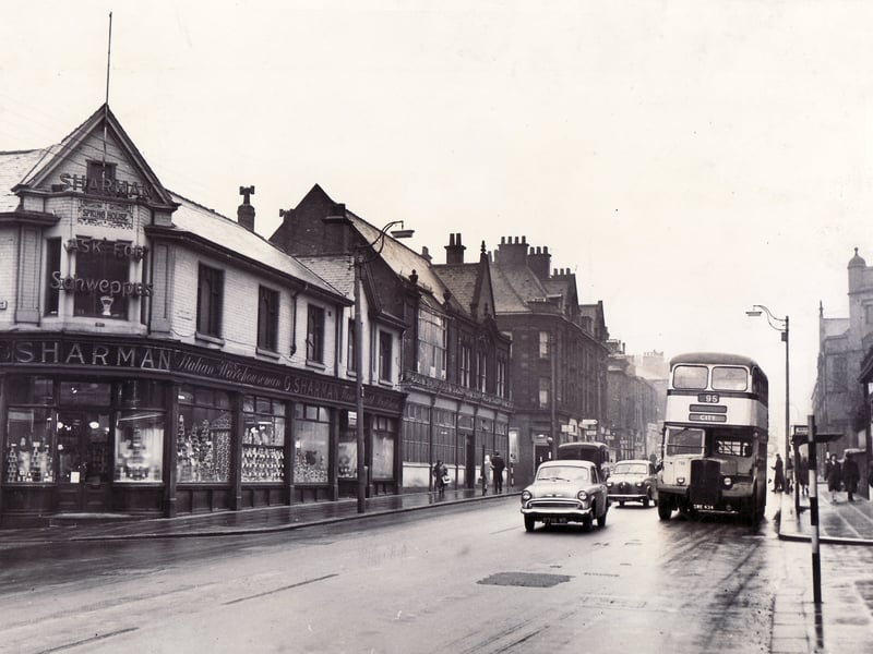 Sharman grocery store on the corner of West Street and Fitzwilliam Street, Sheffield, in January 1961, West Street was described at the time as the 'illustration of a self-contained shopping centre, away from mid-city bustle, yet with stores to meet virtually every demand of the housewife and her family'.