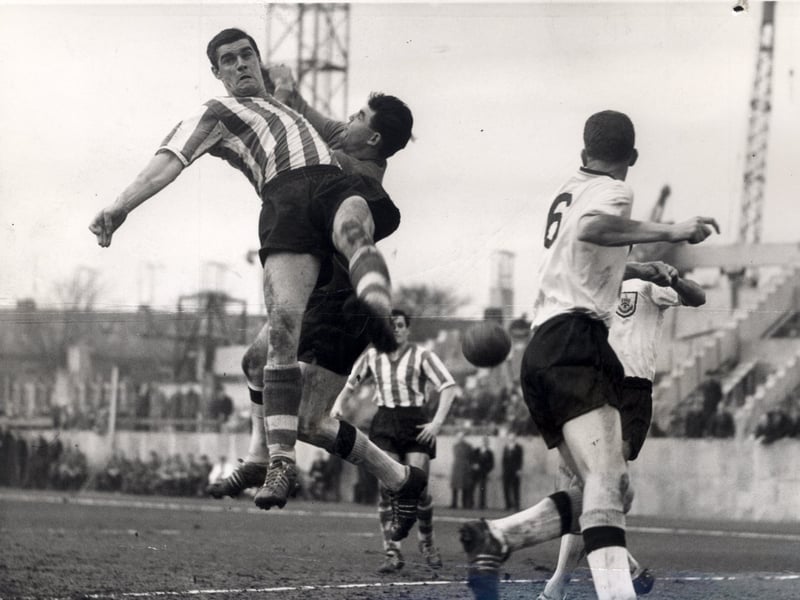 Sheffield Wednesday v Burnley on March 6, 1961. Wednesday's Ellis is pictured leaping for the ball as keeper Blacklaw punches clear.