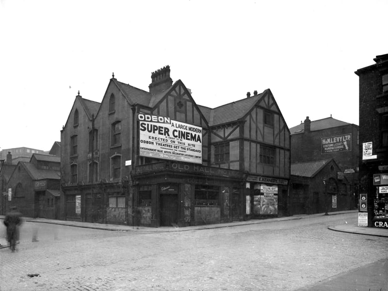 Wade Hall was named after Thomas Wade and built by Thomas Jackson 1630-40. It was partly demolished in 1863 for the building of Kellsall Street. What remained of the building became the Old Hall Hotel. Kelsall Street is to the left and Merrion Street is to the right. A sign states that a new Odeon Cinema is to be built on the site. This did not occur until the Merrion Centre was built here and opened in 1963.