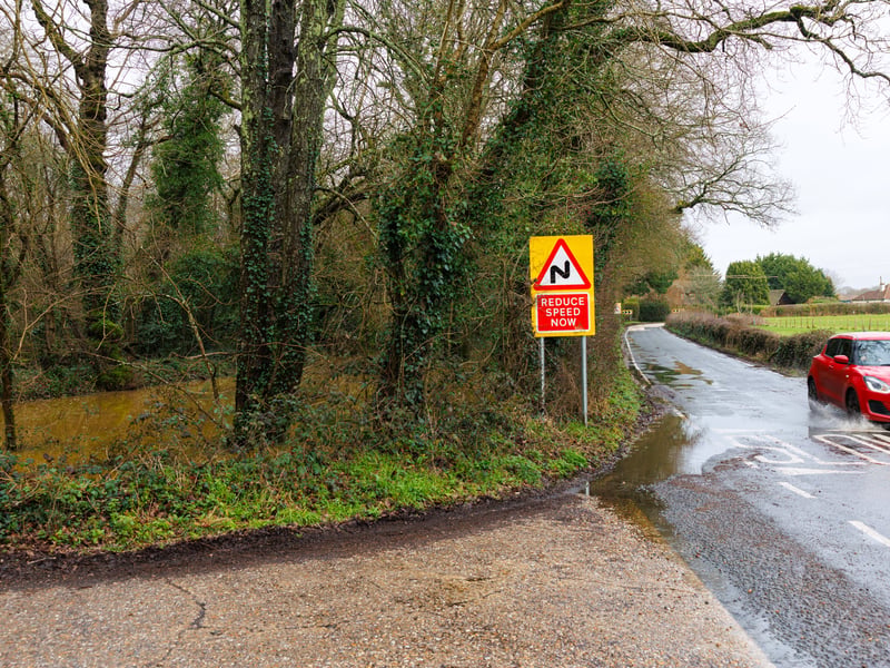 The water is flooding onto Meon Road.