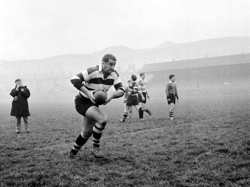 A view of the All Blacks New Zealand rugby team training at Jock's Lodge in November, 1967, showing Brian Miller running with the ball.