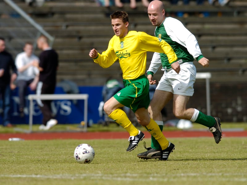 The David Alexander Memorial Trophy match took place at Meadowbank Stadium in June, 2004, between Erin Hibs and Hibs legends, in aid of Children with Cancer and Leukaemia advice and Support for Parents. Pictured are Erin Hibs' (Green) John Valentine and Hibs legends' (Yellow) Gareth Evans.