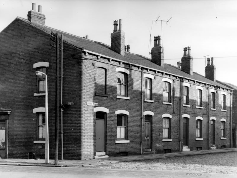 Sturdy Street photographed from the junction with Lady Pit Lane, and showing house numbers 1 to 7 from left to right. These are part of a block of 8 back-to-back terraced properties. Pictured in November 1965.