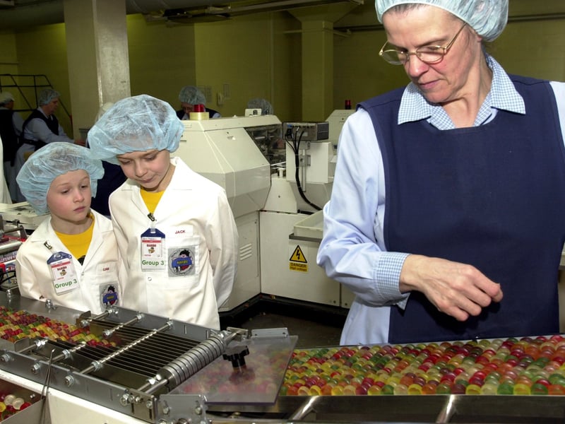 Jack Morrell and Liam Hatt on the production line at the Haribo sweet factory in Pontefract with packer Pat Banks in 2004