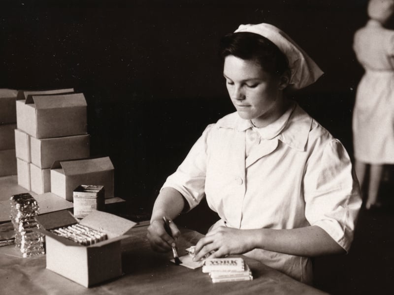 Women pasting York Chocolate into wrappers and packing boxes at the Rowntree factory, York, in 1949