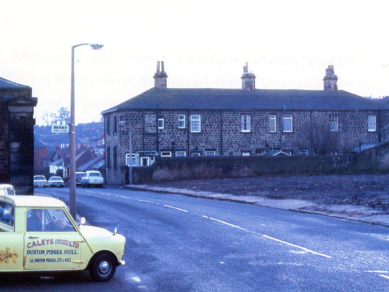 A view along Armley Ridge Road looking towards Stanningley Road taken from the main gates to Gott's Park circa 1970s. The back of Armley Ridge Terrace can be seen to the right. The spare ground on the right was formerly nos. 167-173 Armley Ridge Road.