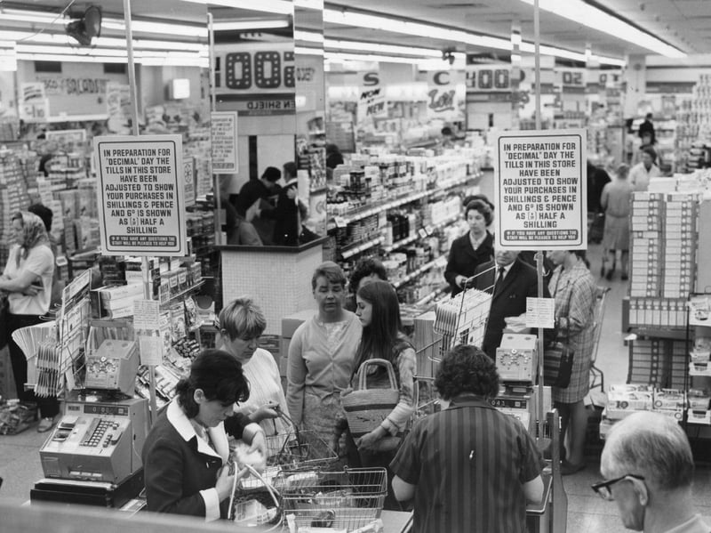 Shoppers queuing at a Tesco supermarket in July 1970, with signs preparing them for 'Decimal Day'