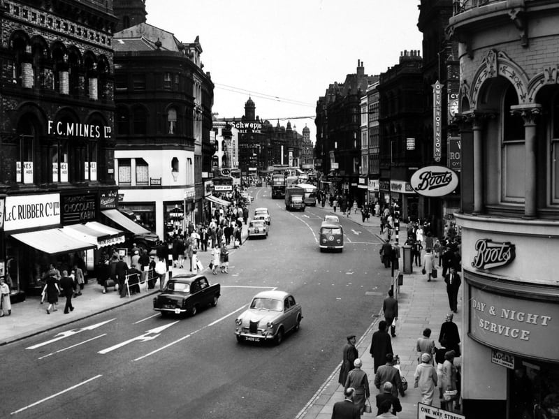 Boar Lane looking towards the Corn Exchange from the Griffin Hotel in August 1962. On the left is the Kee Hong Chinese Restaurant at number 55A Boar Lane, then L & C Rubber Co. Ltd., Thornton's Chocolate Kabin and Bewlay Pipes. The next junction is Albion Street. On the right hand side there is Boots and Owen & Robinson Ltd