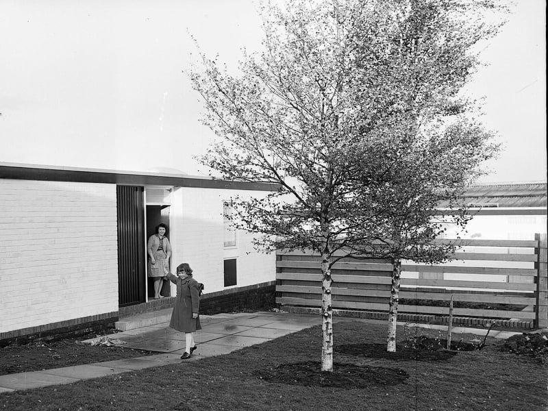 Mrs Elizabeth Buchannan waves goodbye to her daughter Sandra from her new home at the Inchview development in Prestonpans in October 1962.