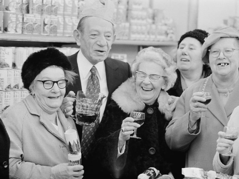 Tesco founder Jack Cohen serving wine to customers in June 1975