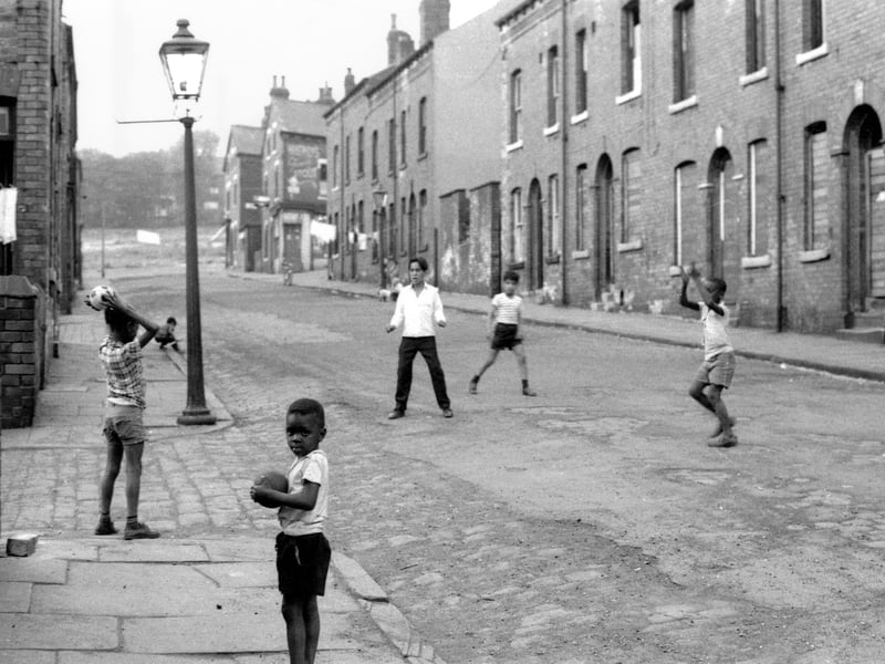A group of young boys playing street ball games in Westfield Crescent. The gas lamp post stands at the corner with Rosebank Street. The two streets seen in the background are left, Back Rosebank Crescent and Rosebank Crescent. Beyond Woodsley Road, at the top of Westfield Crescent, is just visible.
