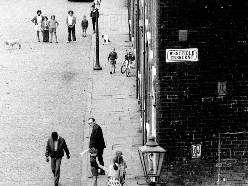 Rillbank Street where several people can be seen, including children playing, at the junction with Westfield Crescent. The photographer, Eric Jacquier, was standing on one of several flights of steps leading down from Rosebank Road.
